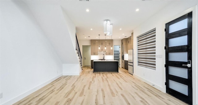 2316 Arroyo Ave, Dallas, TX 75219 - entrance foyer with light wood-style floors, baseboards, and recessed lighting