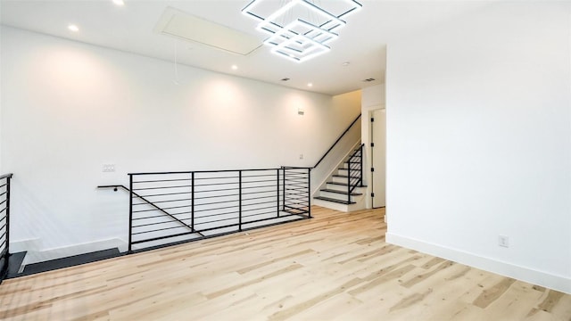 2316 Arroyo Ave, Dallas, TX 75219 - empty room with attic access, wood finished floors, recessed lighting, and baseboards