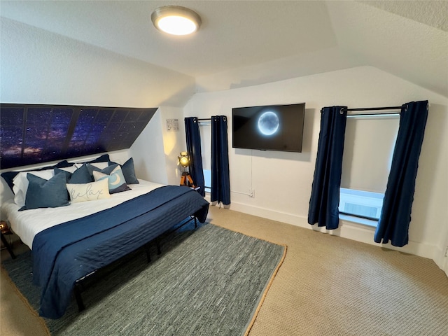 carpeted bedroom featuring lofted ceiling