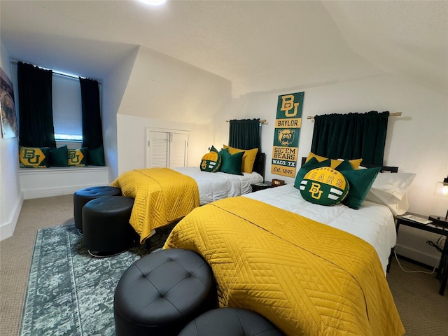 bedroom featuring carpet floors and vaulted ceiling