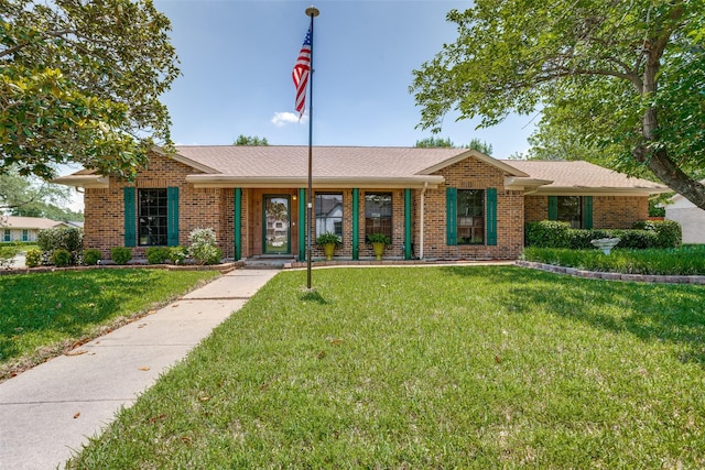 3150 Palmdale Cir, Farmers Branch, TX 75234 - single story home featuring a front yard and brick siding