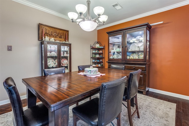 3150 Palmdale Cir, Farmers Branch, TX 75234 - dining space with a chandelier, baseboards, dark wood-style flooring, ornamental molding, and french doors
