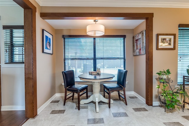 3150 Palmdale Cir, Farmers Branch, TX 75234 - dining area with plenty of natural light, baseboards, and crown molding