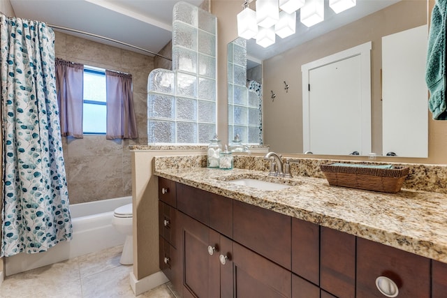 3150 Palmdale Cir, Farmers Branch, TX 75234 - bathroom featuring vanity, toilet, shower / bath combo with shower curtain, and tile patterned floors