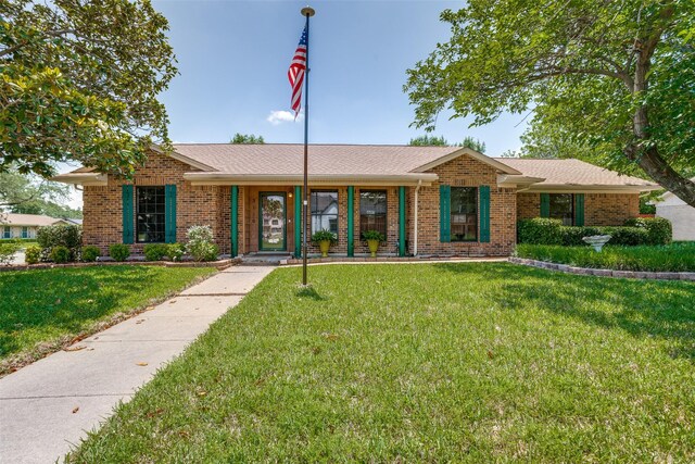 3150 Palmdale Cir, Farmers Branch, TX 75234 - single story home featuring a front lawn and brick siding