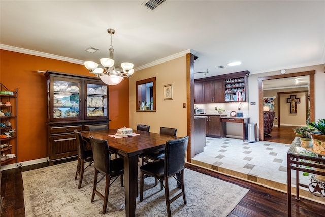 3150 Palmdale Cir, Farmers Branch, TX 75234 - dining room with light wood-style flooring, a chandelier, crown molding, baseboards, and recessed lighting