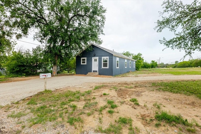 exterior space with driveway and entry steps