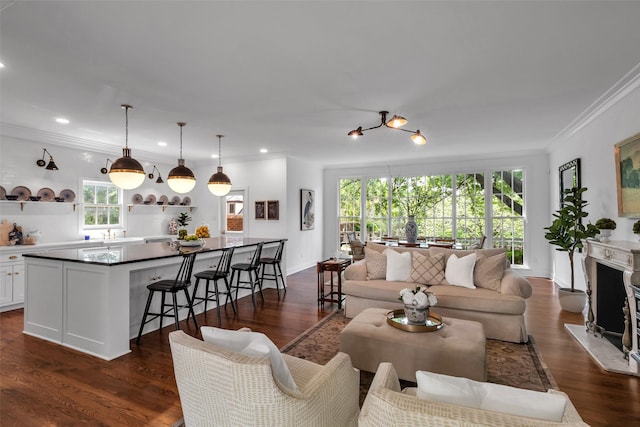 8 Westover Rd, Westover Hills, TX 76107 - living room featuring crown molding, dark wood-style flooring, a fireplace, recessed lighting, and baseboards