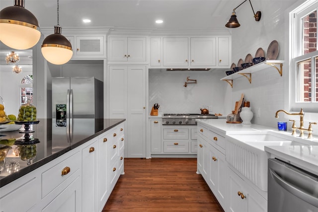 8 Westover Rd, Westover Hills, TX 76107 - kitchen with backsplash, stainless steel appliances, dark wood-style floors, and white cabinetry