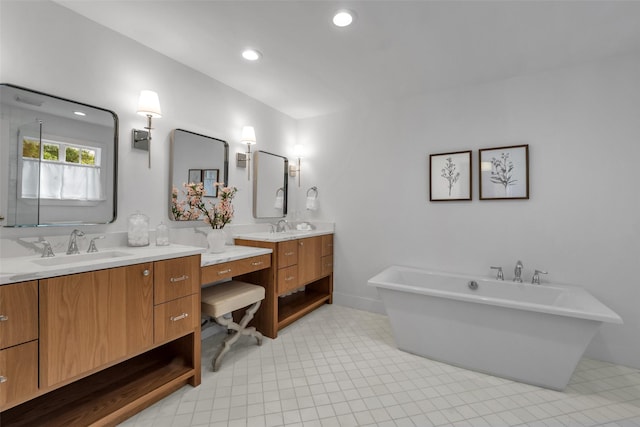 8 Westover Rd, Westover Hills, TX 76107 - bathroom featuring a soaking tub, recessed lighting, two vanities, and a sink