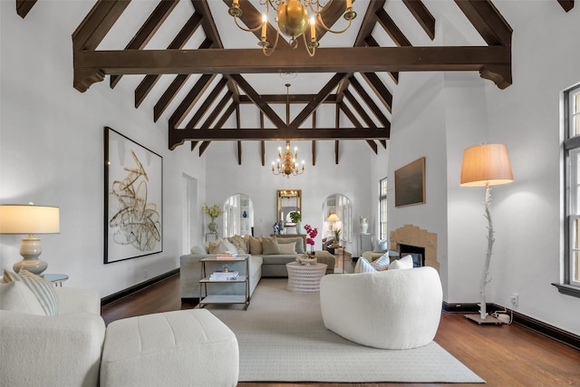 8 Westover Rd, Westover Hills, TX 76107 - living area with an inviting chandelier, wood finished floors, a fireplace, beamed ceiling, and high vaulted ceiling