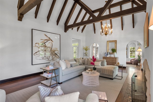 8 Westover Rd, Westover Hills, TX 76107 - living area with beam ceiling, wood finished floors, high vaulted ceiling, arched walkways, and a notable chandelier