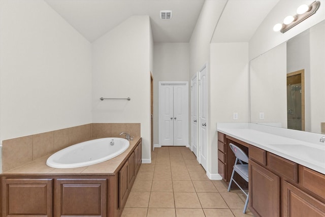 bathroom featuring tile patterned flooring, vanity, visible vents, a bath, and a stall shower