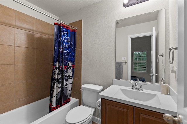 bathroom with vanity, a textured wall, toilet, and shower / tub combo with curtain