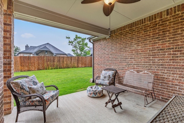 view of patio featuring a fenced backyard and a ceiling fan