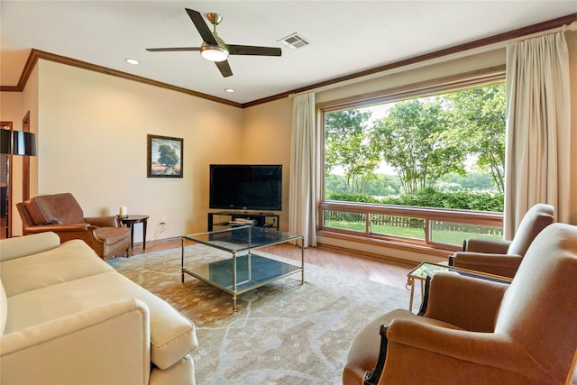 living area featuring a ceiling fan, visible vents, wood finished floors, ornamental molding, and recessed lighting