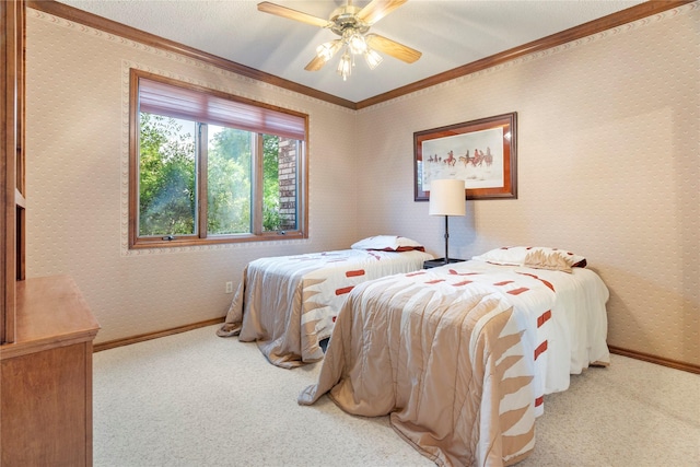 carpeted bedroom with baseboards, ornamental molding, ceiling fan, and wallpapered walls