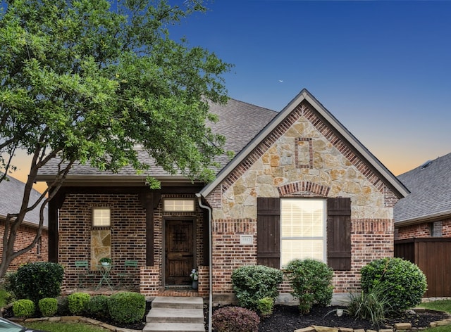 5312 Oakley Rd, Mckinney, TX 75070 - unfurnished dining area featuring crown molding, baseboards, wood finished floors, and a notable chandelier