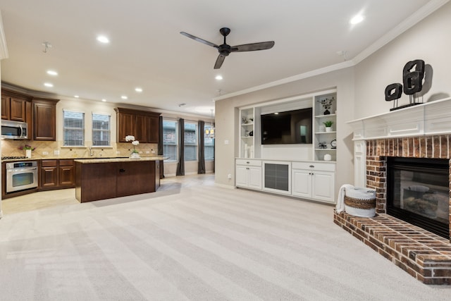 5312 Oakley Rd, Mckinney, TX 75070 - kitchen with light tile patterned floors, light stone counters, a sink, crown molding, and appliances with stainless steel finishes