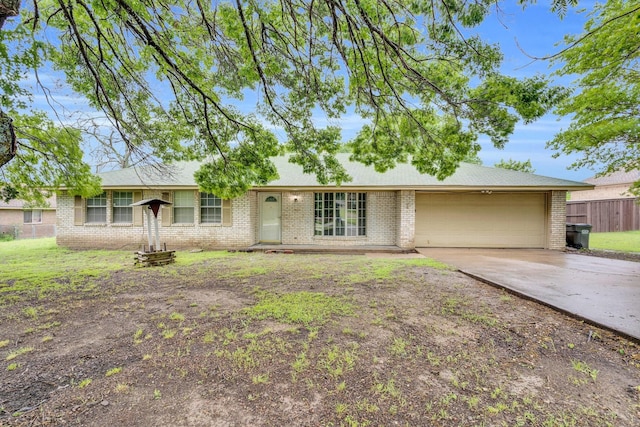 503 Bluebonnet Ln, Red Oak, TX 75154 - single story home with concrete driveway, brick siding, fence, and a garage