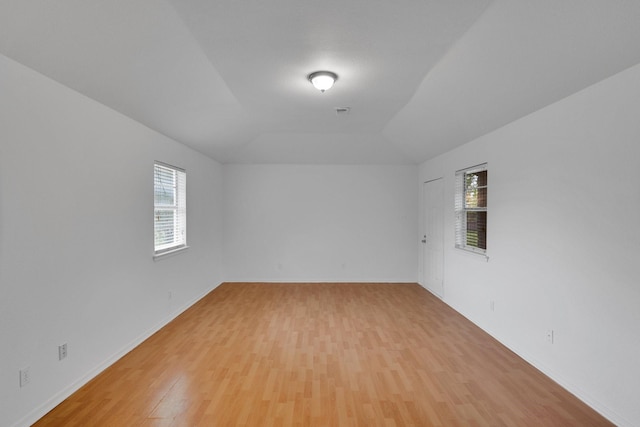 503 Bluebonnet Ln, Red Oak, TX 75154 - empty room featuring light wood-type flooring, baseboards, and lofted ceiling