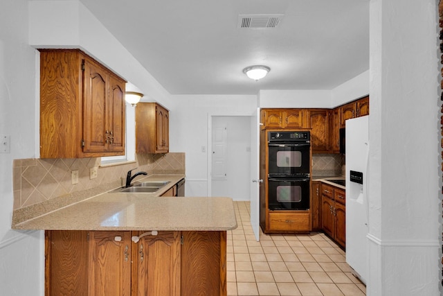 503 Bluebonnet Ln, Red Oak, TX 75154 - kitchen with dobule oven black, backsplash, visible vents, a sink, and a peninsula