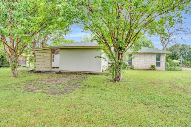 503 Bluebonnet Ln, Red Oak, TX 75154 - exterior space featuring brick siding, fence, a yard, and a chimney