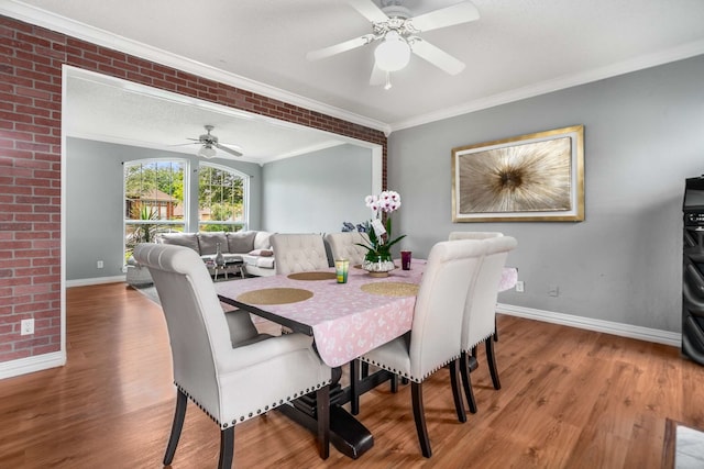 2306 Edinburgh Way, Garland, TX 75040 - dining area featuring a ceiling fan, baseboards, wood finished floors, and crown molding