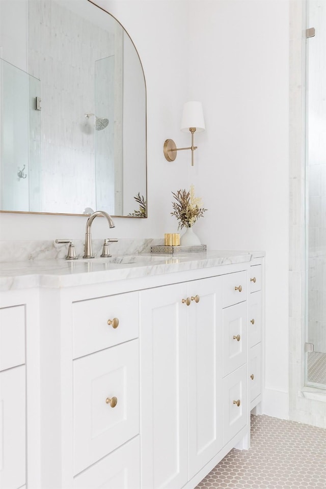 full bathroom featuring vanity and a stall shower