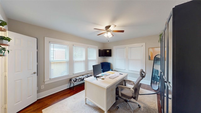 office with dark wood-style flooring, ceiling fan, and baseboards