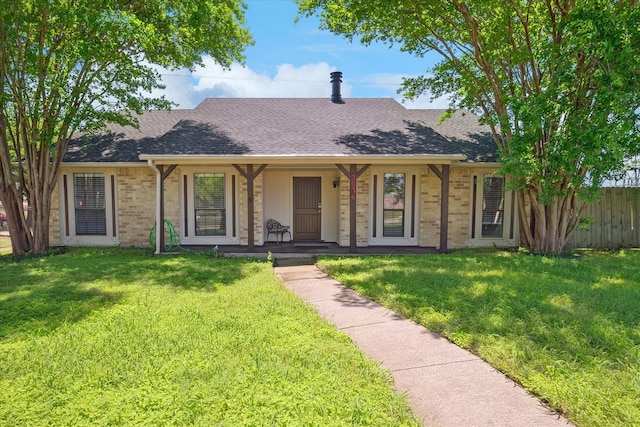 2036 Apple Valley Rd, Plano, TX 75023 - ranch-style house with covered porch, brick siding, a shingled roof, and a front yard