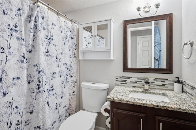 2036 Apple Valley Rd, Plano, TX 75023 - full bathroom featuring a shower with curtain, a textured ceiling, tasteful backsplash, vanity, and toilet