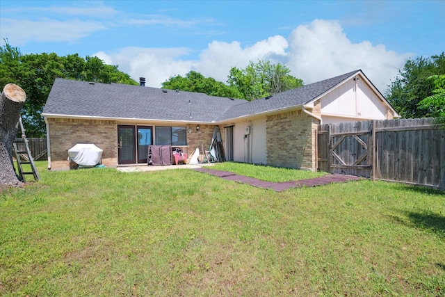 2036 Apple Valley Rd, Plano, TX 75023 - rear view of house with a yard, brick siding, a shingled roof, and a fenced backyard