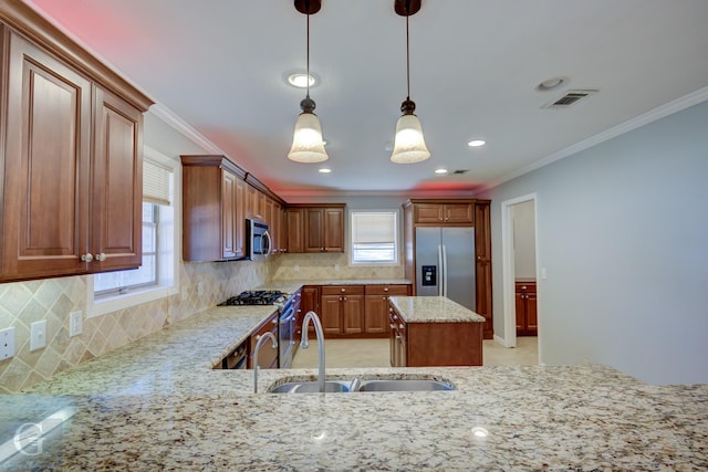 kitchen with crown molding, a sink, backsplash, and stainless steel appliances
