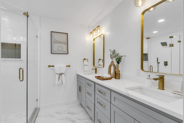 full bath with baseboards, a shower stall, a sink, and marble finish floor
