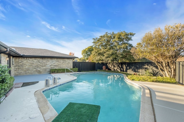 view of swimming pool featuring a fenced backyard, a fenced in pool, and a patio area
