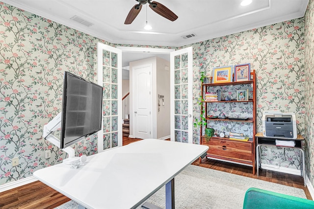 office featuring wallpapered walls, visible vents, ornamental molding, and wood finished floors