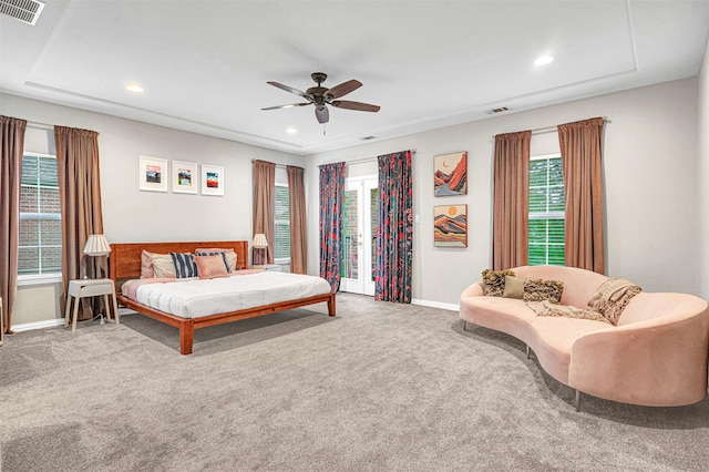 carpeted bedroom featuring baseboards, multiple windows, recessed lighting, and visible vents