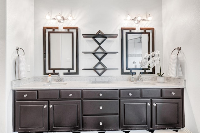full bath with a sink and double vanity