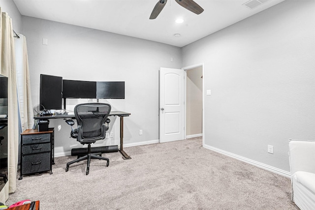 home office featuring a ceiling fan, carpet flooring, visible vents, and baseboards