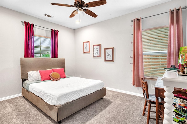 bedroom with baseboards, ceiling fan, visible vents, and carpet floors