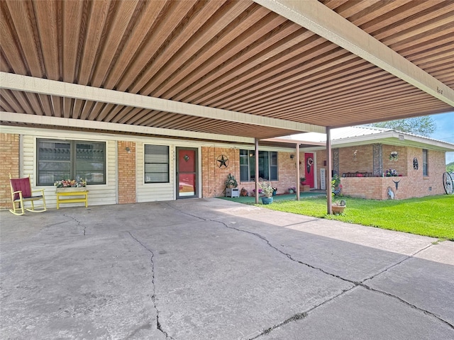 exterior space featuring a front lawn and brick siding