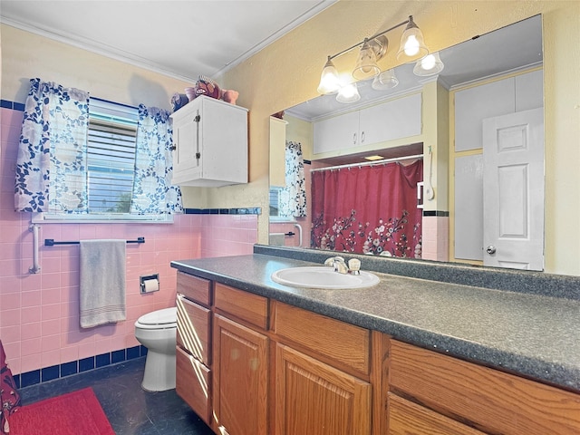 full bathroom featuring crown molding, wainscoting, vanity, toilet, and tile walls
