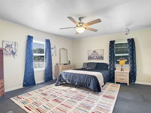 bedroom with dark carpet, ornamental molding, and baseboards