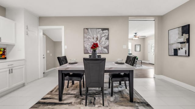 10018 Jackson Rd, Krum, TX 76249 - dining area with baseboards, a ceiling fan, and light tile patterned floors