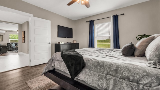 10018 Jackson Rd, Krum, TX 76249 - bedroom with a ceiling fan and wood finished floors