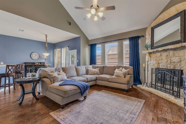 15604 Christopher Ln, Frisco, TX 75035 - living room featuring a fireplace, dark wood finished floors, a ceiling fan, and high vaulted ceiling