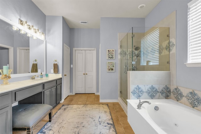 15604 Christopher Ln, Frisco, TX 75035 - full bath with tile patterned flooring, a jetted tub, a shower stall, and vanity