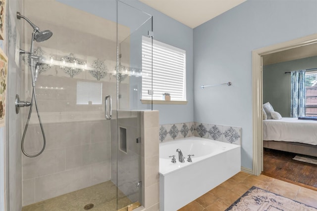 15604 Christopher Ln, Frisco, TX 75035 - bathroom with a garden tub, a shower stall, ensuite bath, and tile patterned floors