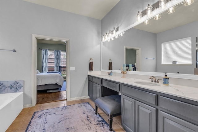 15604 Christopher Ln, Frisco, TX 75035 - full bath featuring tile patterned floors, double vanity, ensuite bathroom, and a garden tub